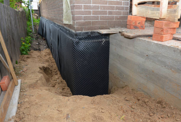Happy homeowners after waterproofing job in Sodus Point